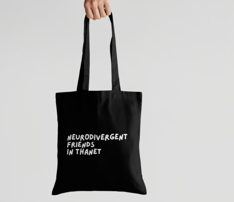 Black tote bag with a large "Neurodivergent Friends in Thanet" logo.